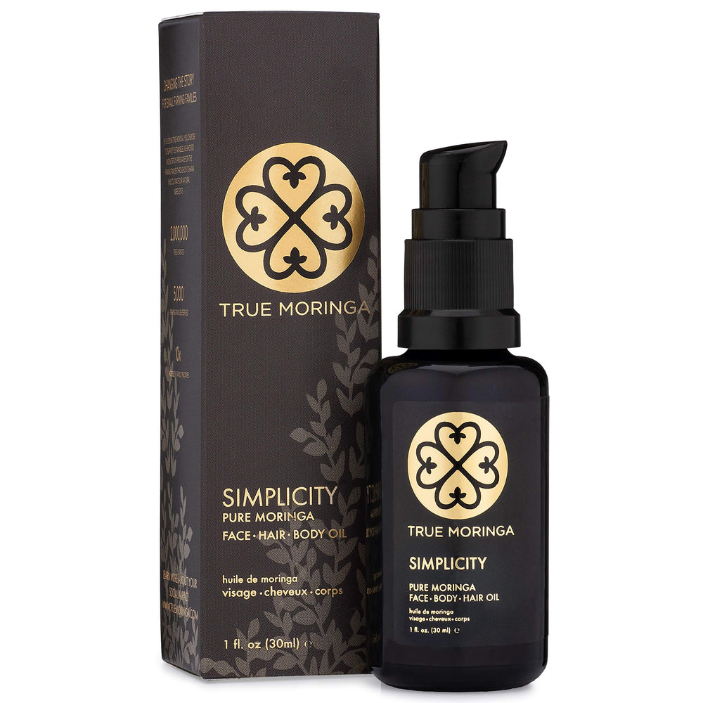 True Moringa Oil bottle closeup showing pure unscented formula for nourished skin