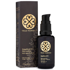 True Moringa Oil bottle closeup showing pure unscented formula for nourished skin