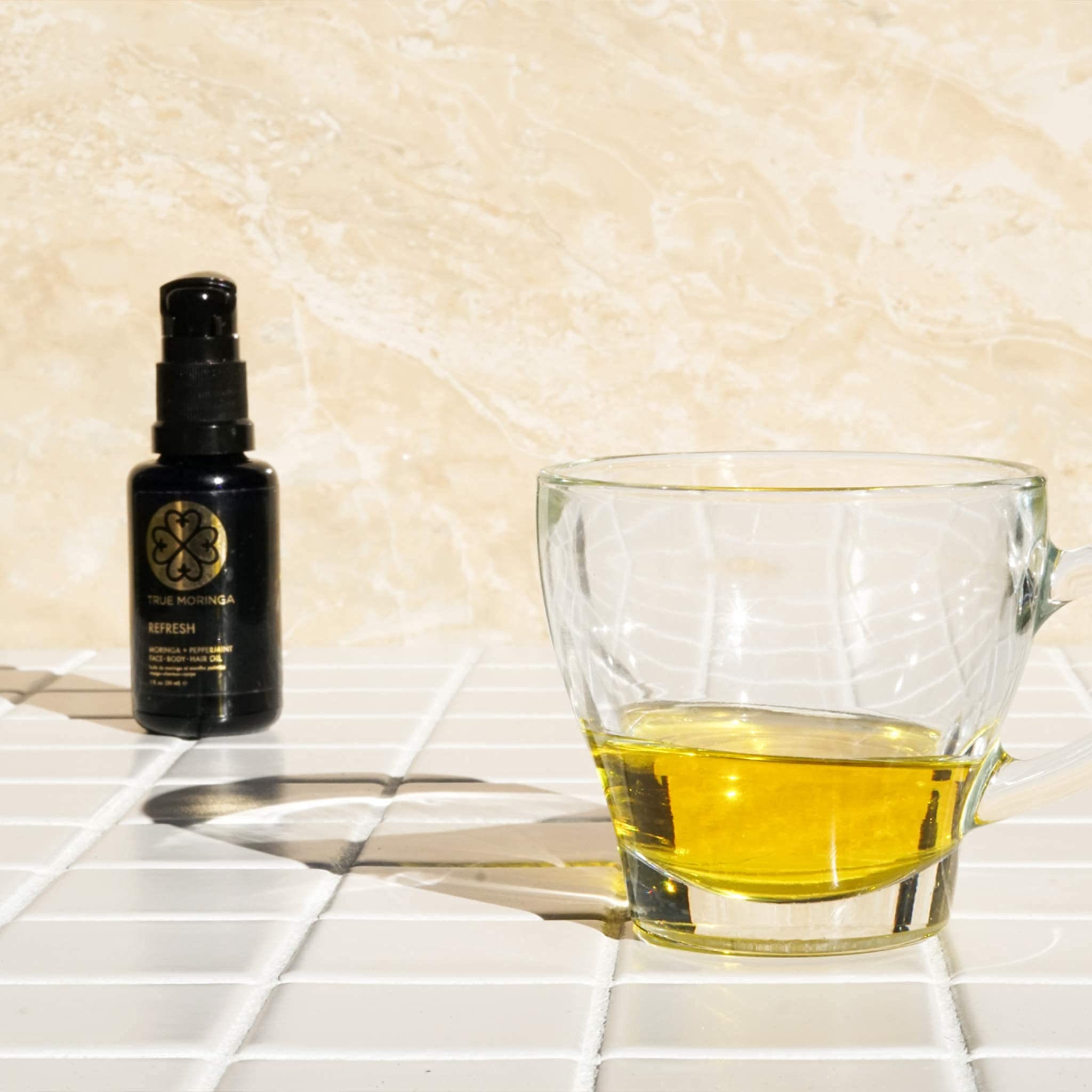 True Moringa Oil in UV glass bottle protects natural properties