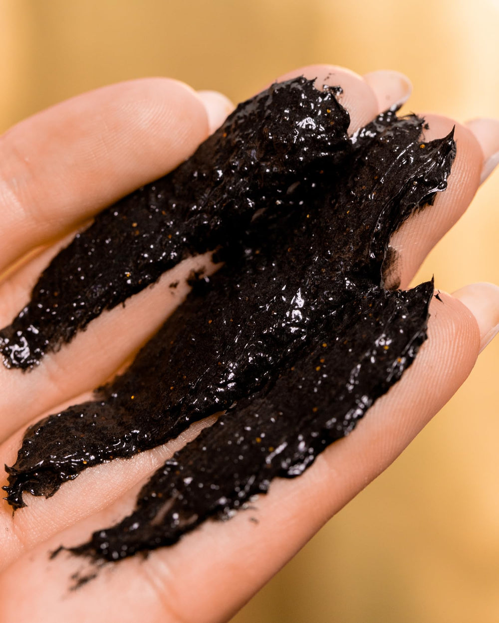 Truly 24K Gold Black Soap gold flakes visible for spa-like cleansing