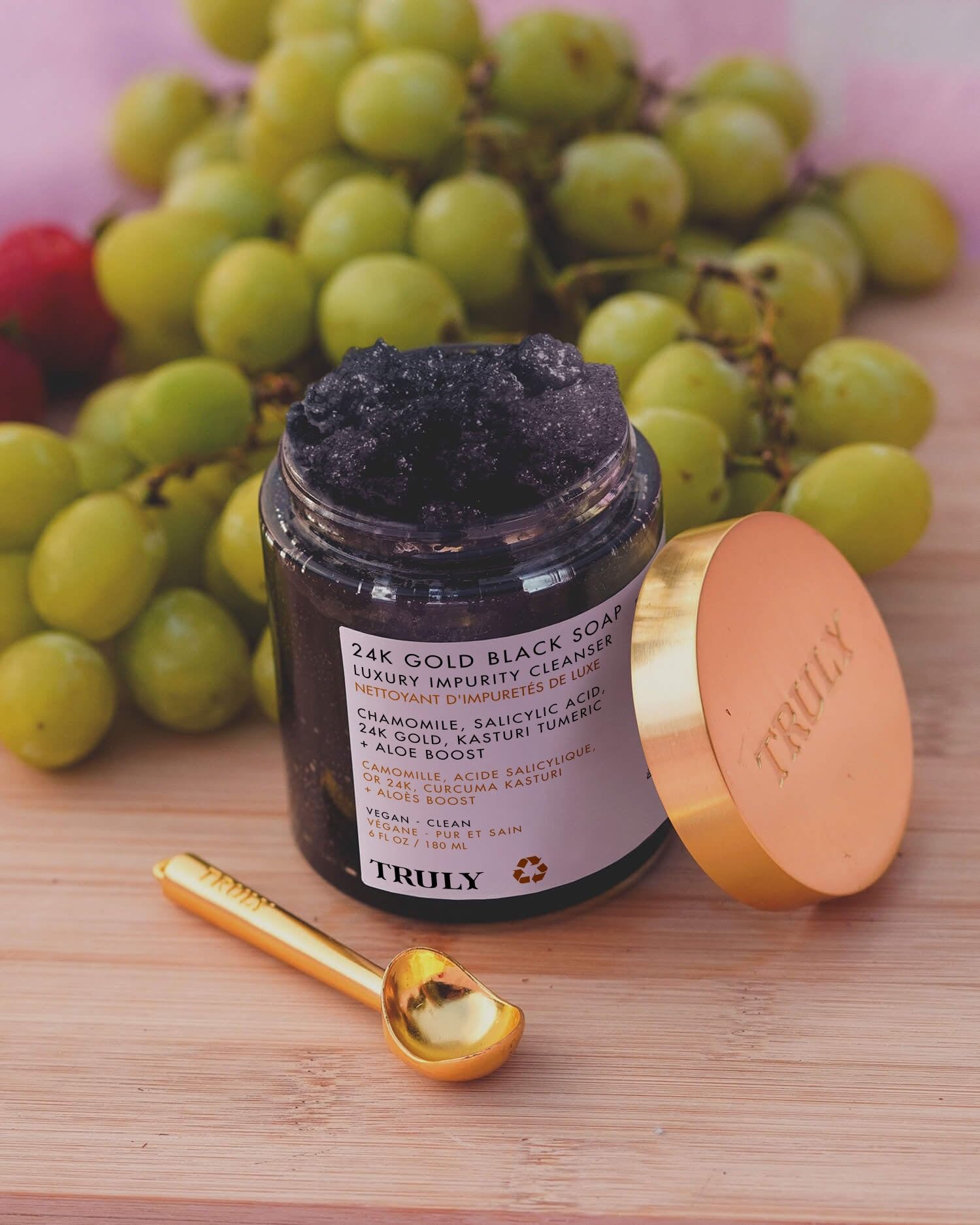 Truly 24K Gold Black Soap jar highlighting creamy formula for gentle exfoliation and nourishment