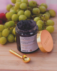 Truly 24K Gold Black Soap jar highlighting creamy formula for gentle exfoliation and nourishment