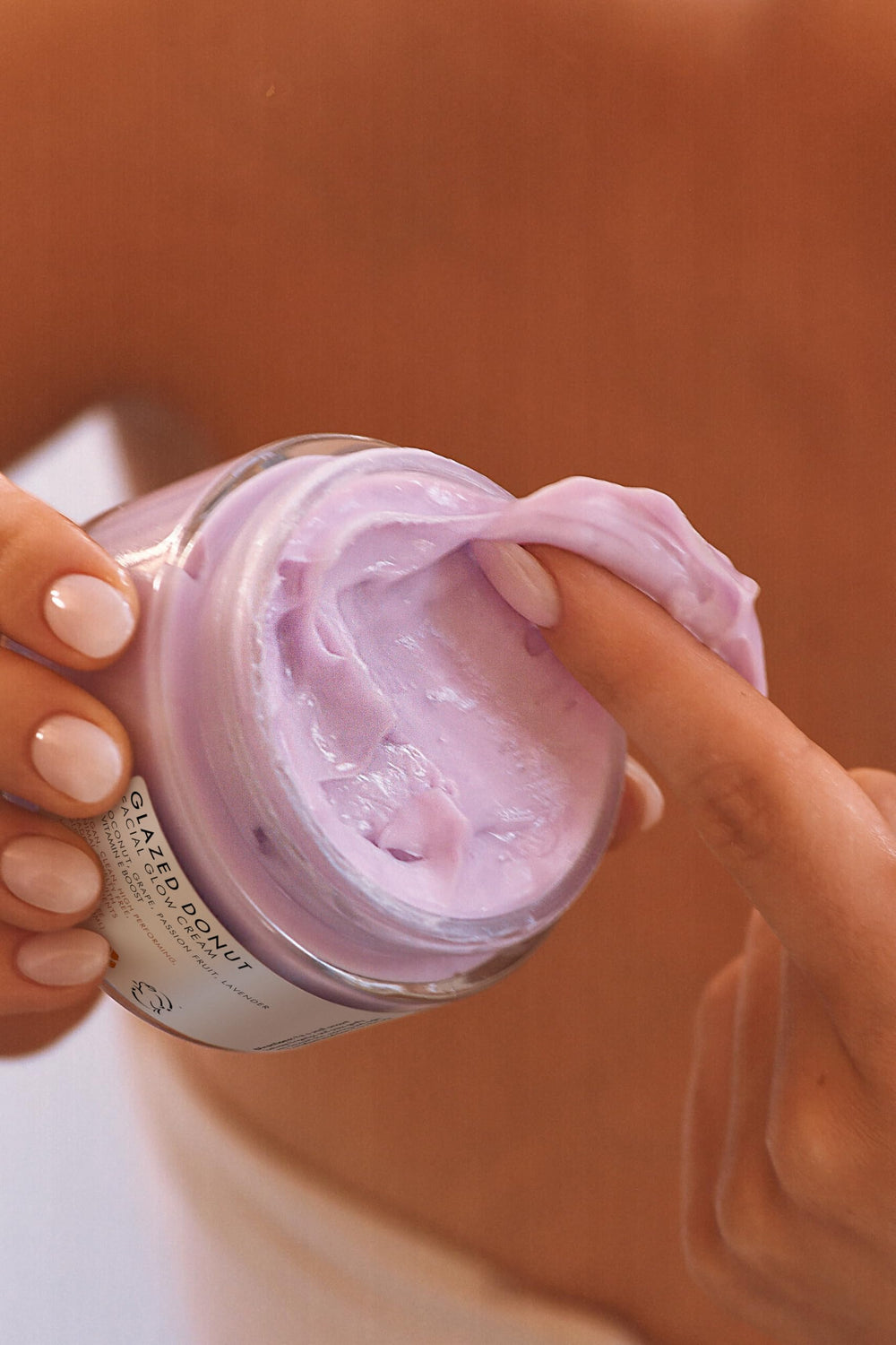 Truly Glazed Donut After Shave Glow Cream on bathroom counter suggests daily hydration.