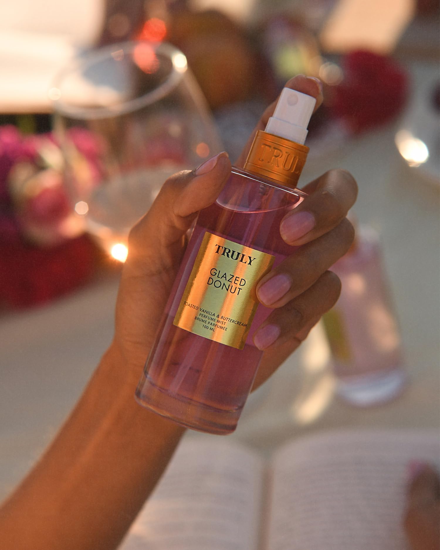 Truly Glazed Donut application on skin demonstrates lightweight mist for daytime wear.