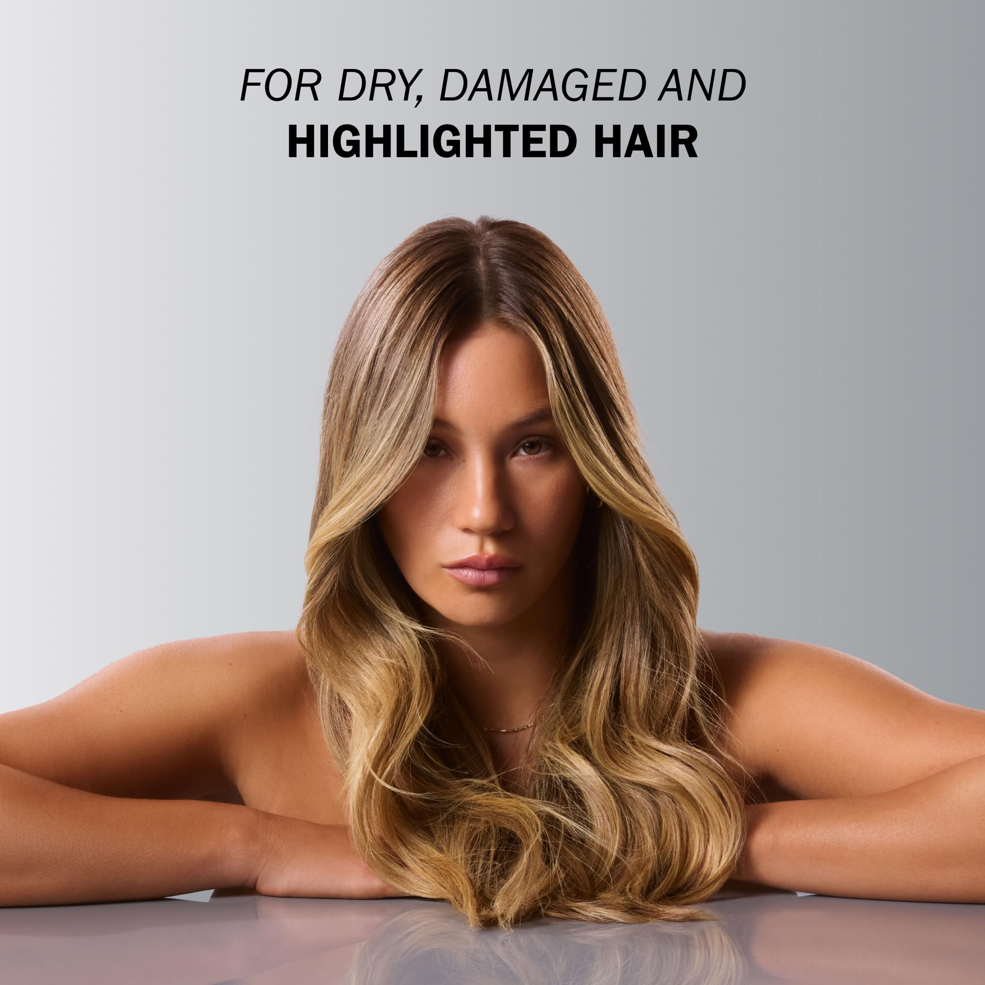 TRUSS Blond Conditioner being applied to damp hair for moisture.