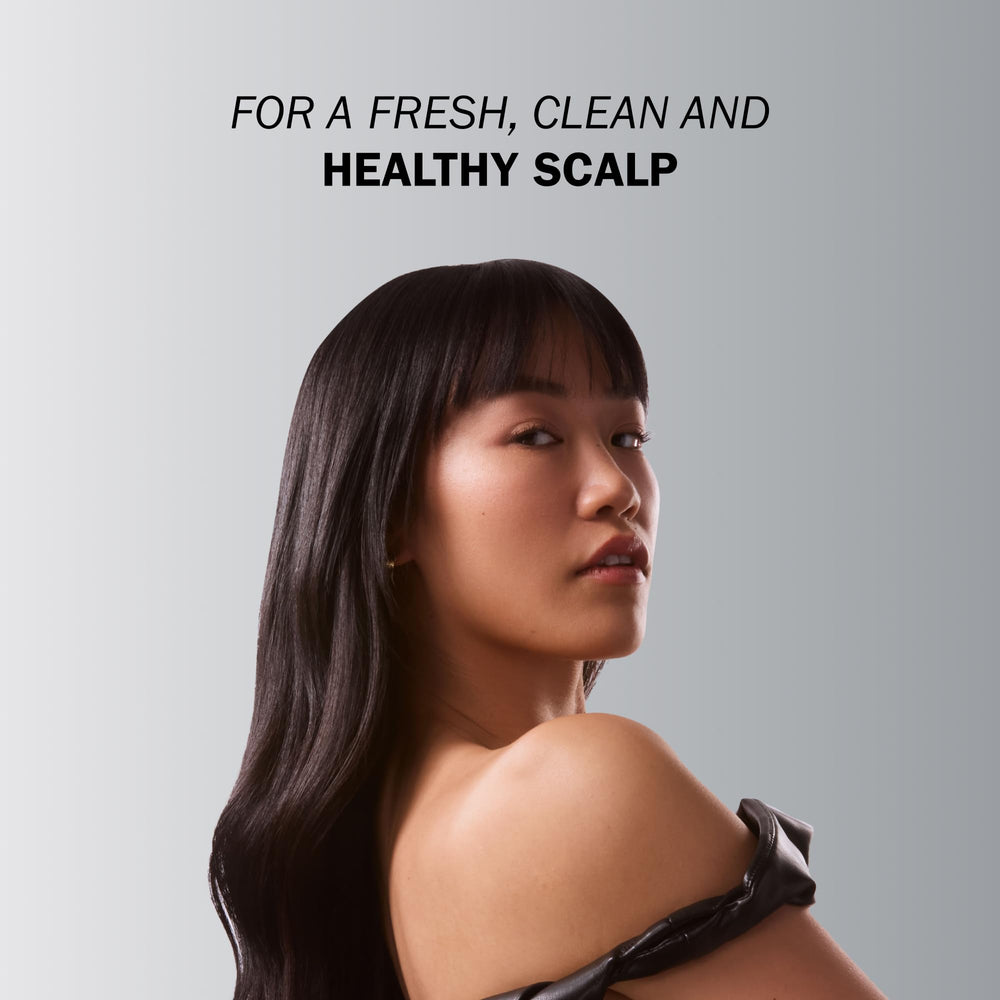 TRUSS Therapy Menthol splash highlights cooling sensation during scalp cleanse.