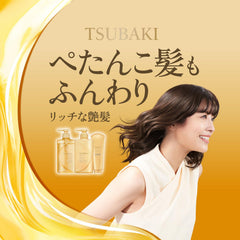 Tsubaki Premium Repair Conditioner being applied aids detangling and manageability.