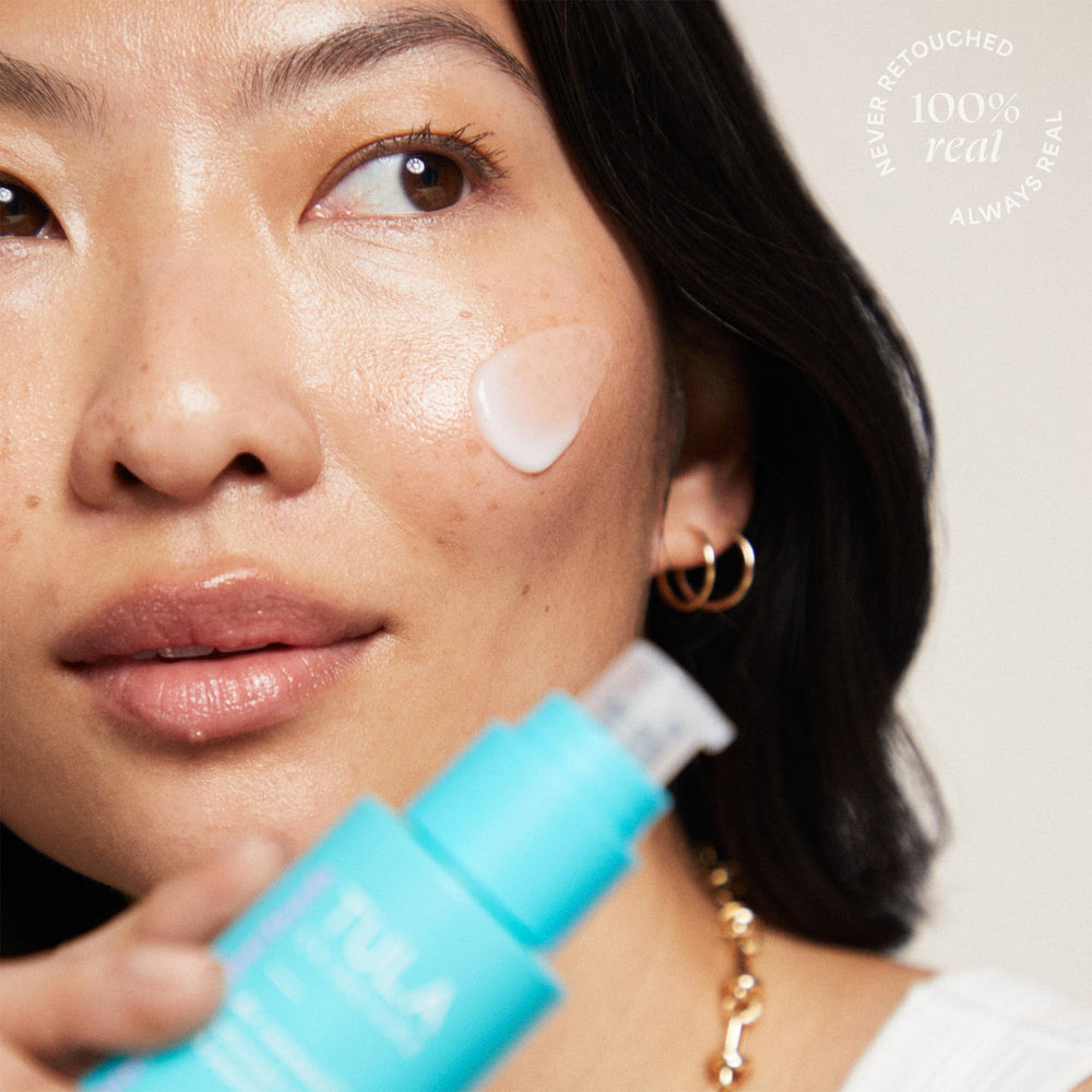 TULA A+ Renewal serum bottle shown in a nighttime skincare routine
