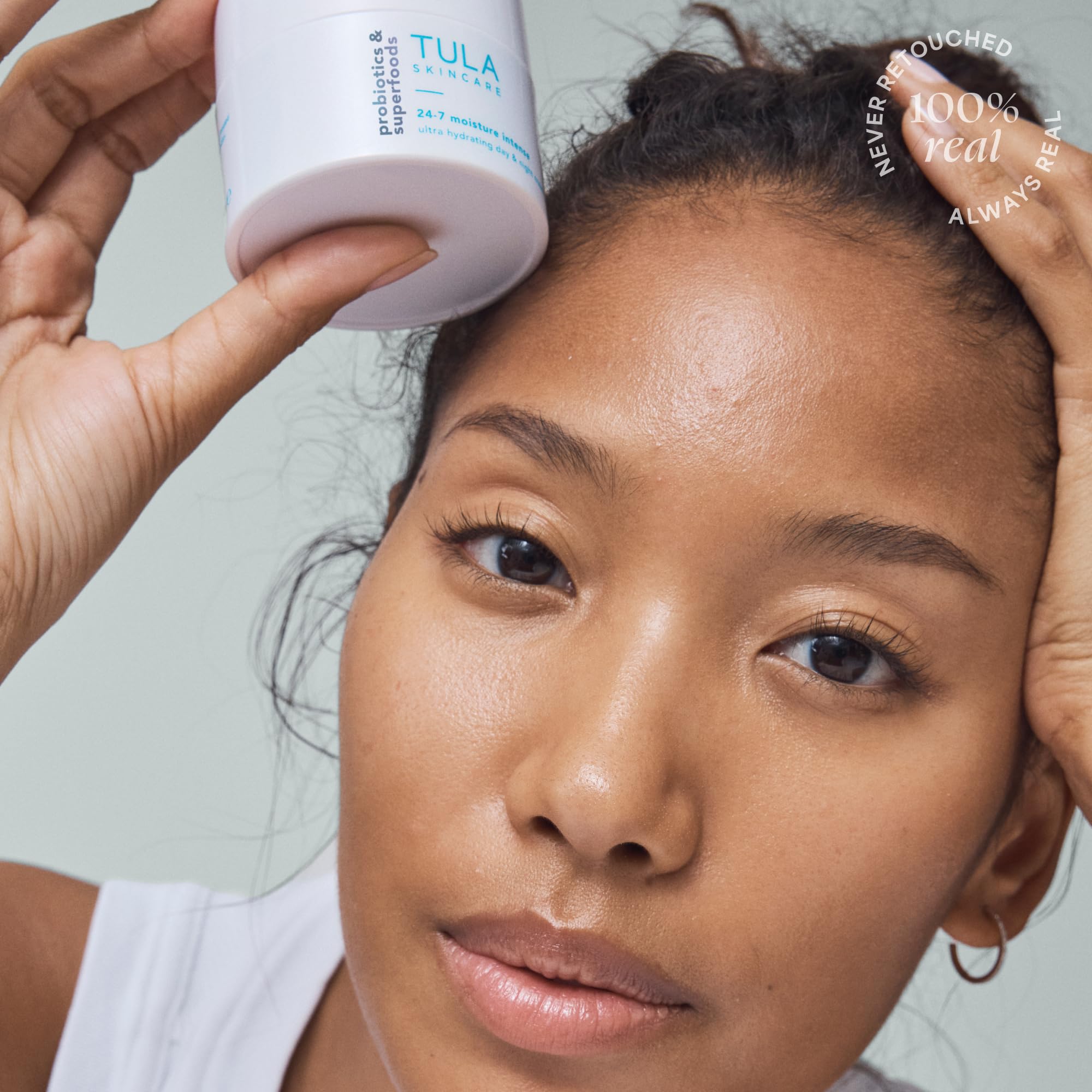 TULA application close-up showing cream on clean skin for daily use.