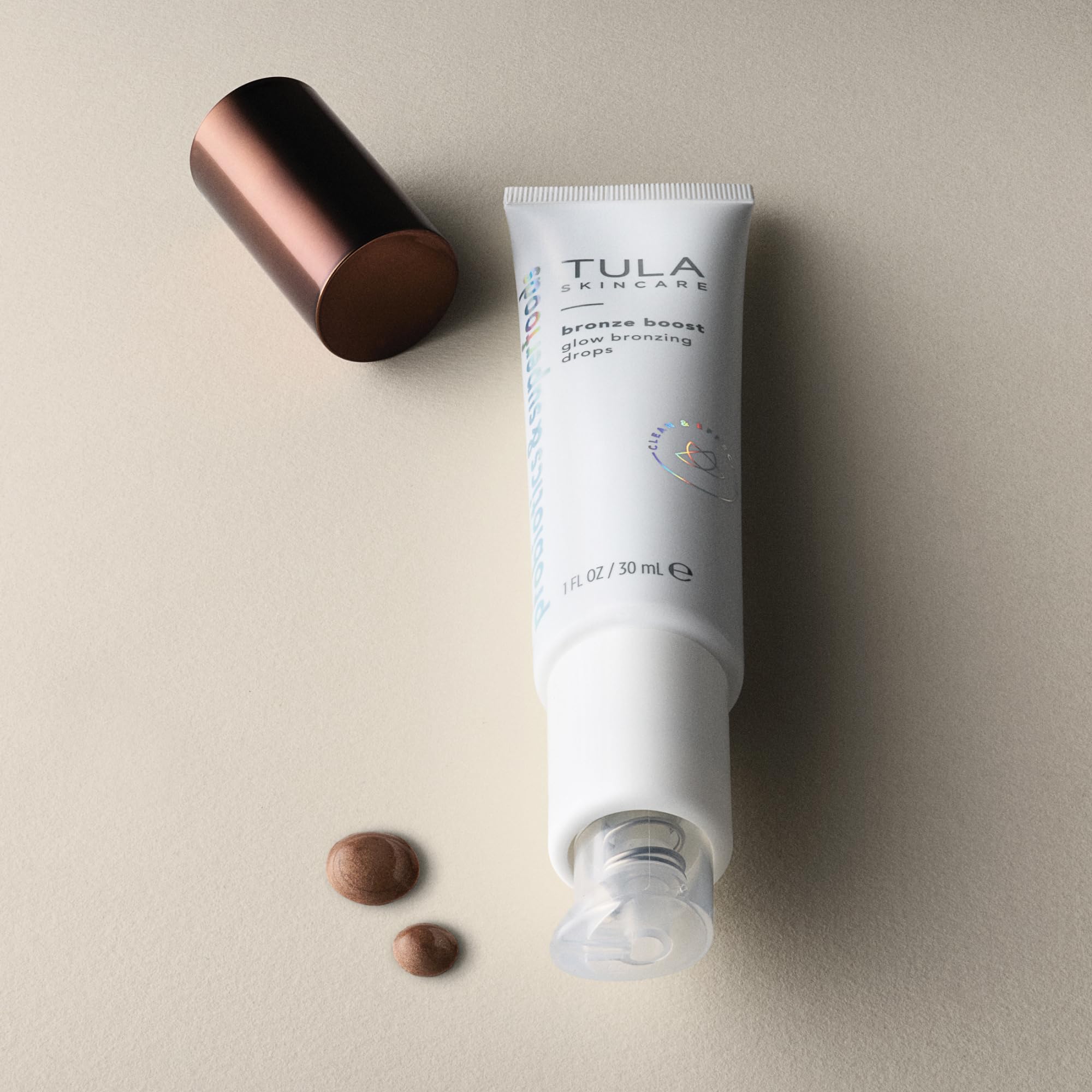 TULA Bronze Boost Glow Drops closer-look highlights Rainbow Seabright and Copper Peptides in action