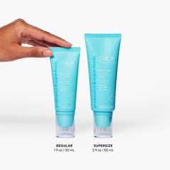 TULA Sunrise Primer on makeup-ready skin highlights radiant finish.