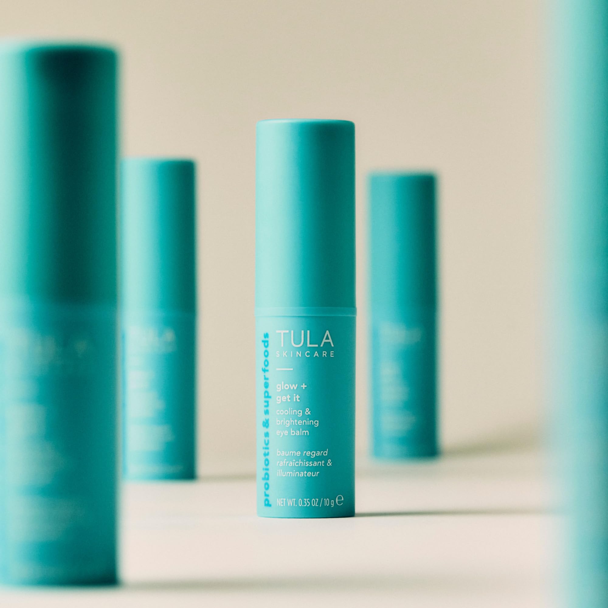 TULA Glow & Get It Eye Balm before-and-after puffiness look comparison.