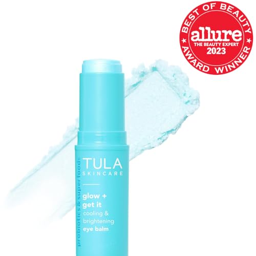 TULA Glow & Get It Eye Balm tube dispensing for instant under-eye hydration.