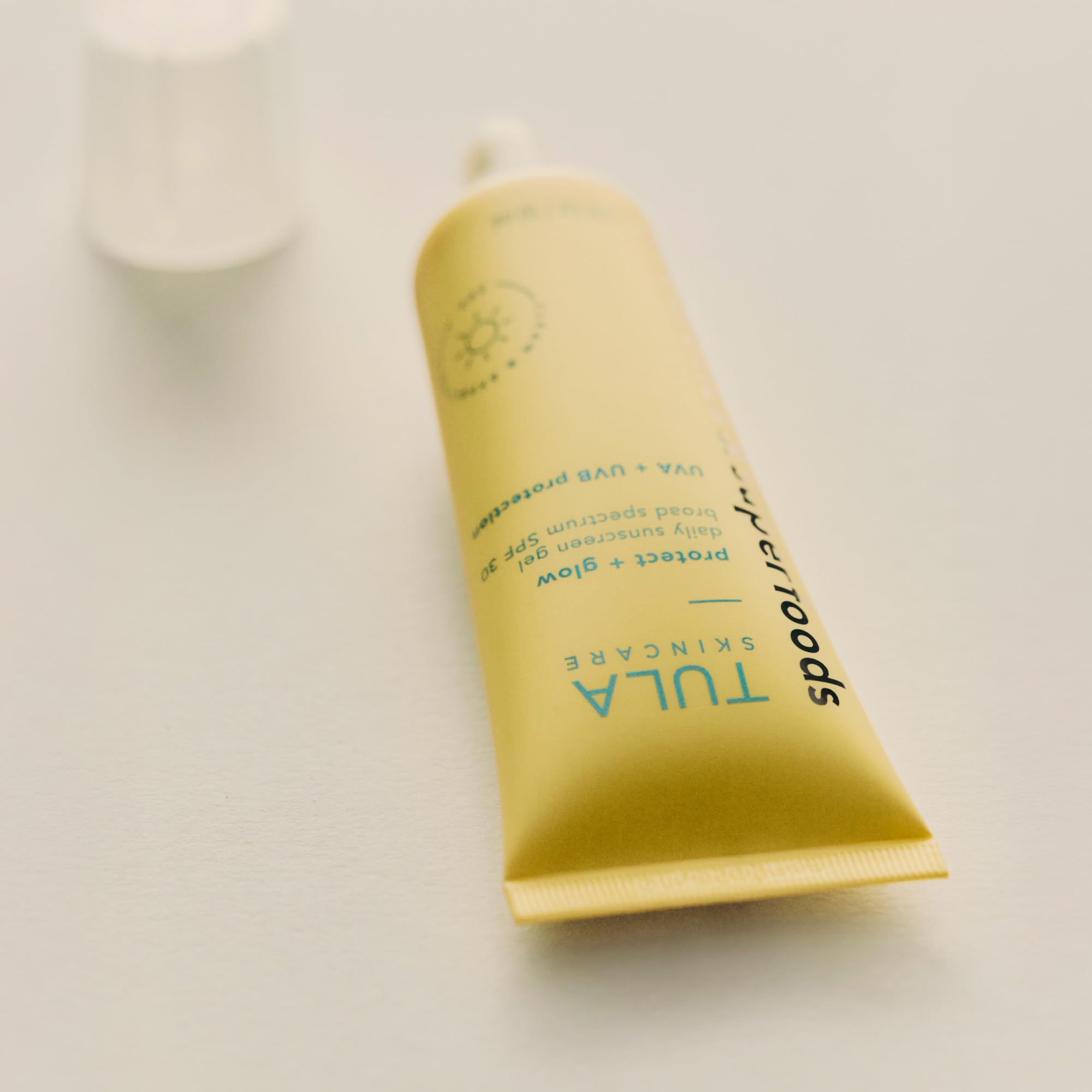 TULA Protect + Glow packaging shot signaling reef-safe, daily SPF 30.