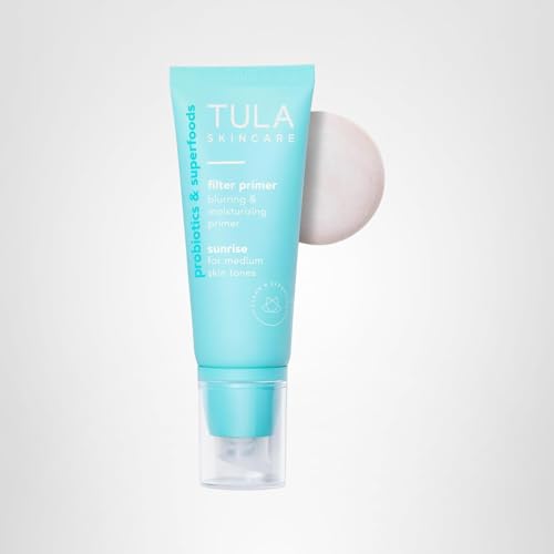TULA Sunrise primer beside makeup tools suggests versatile all-day wear.