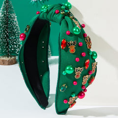 TULOBI headband with knotted design and pearl detailing for elegant holiday looks