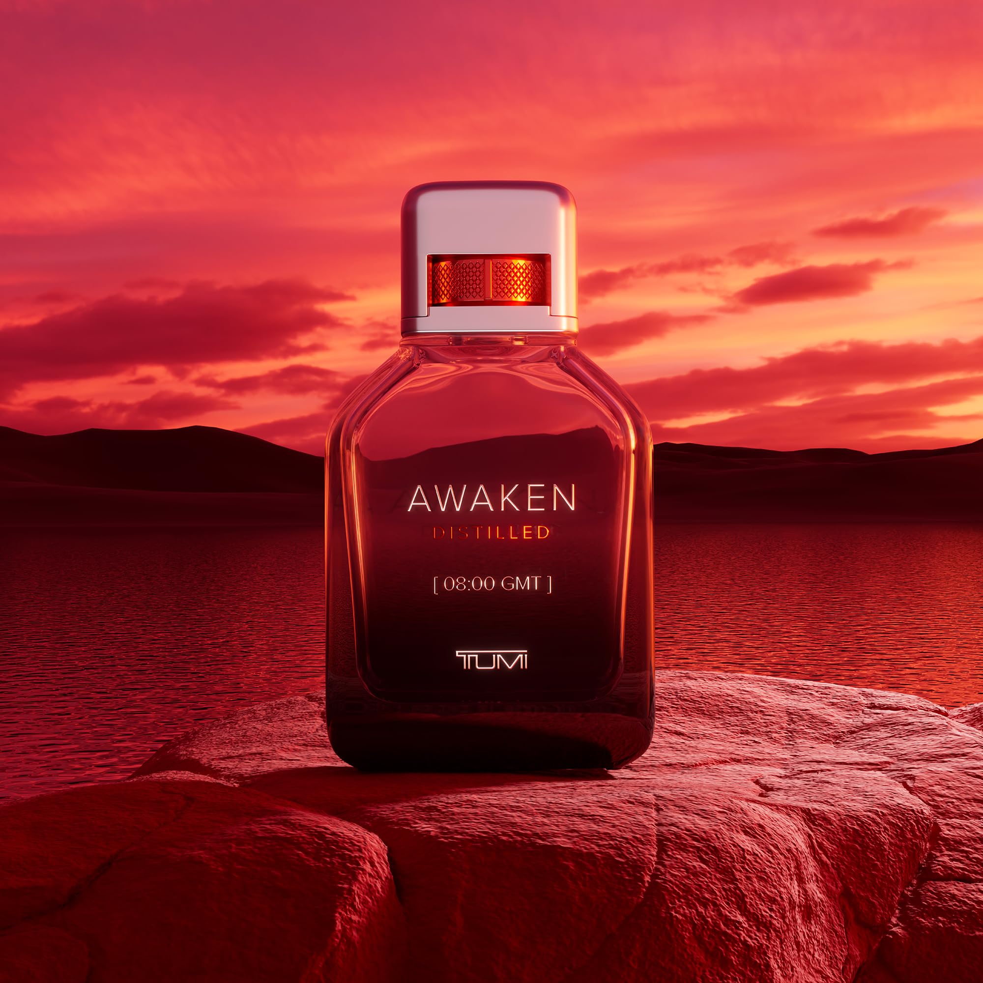 TUMI AWAKEN Distilled bottle in hand for travel-ready scent.