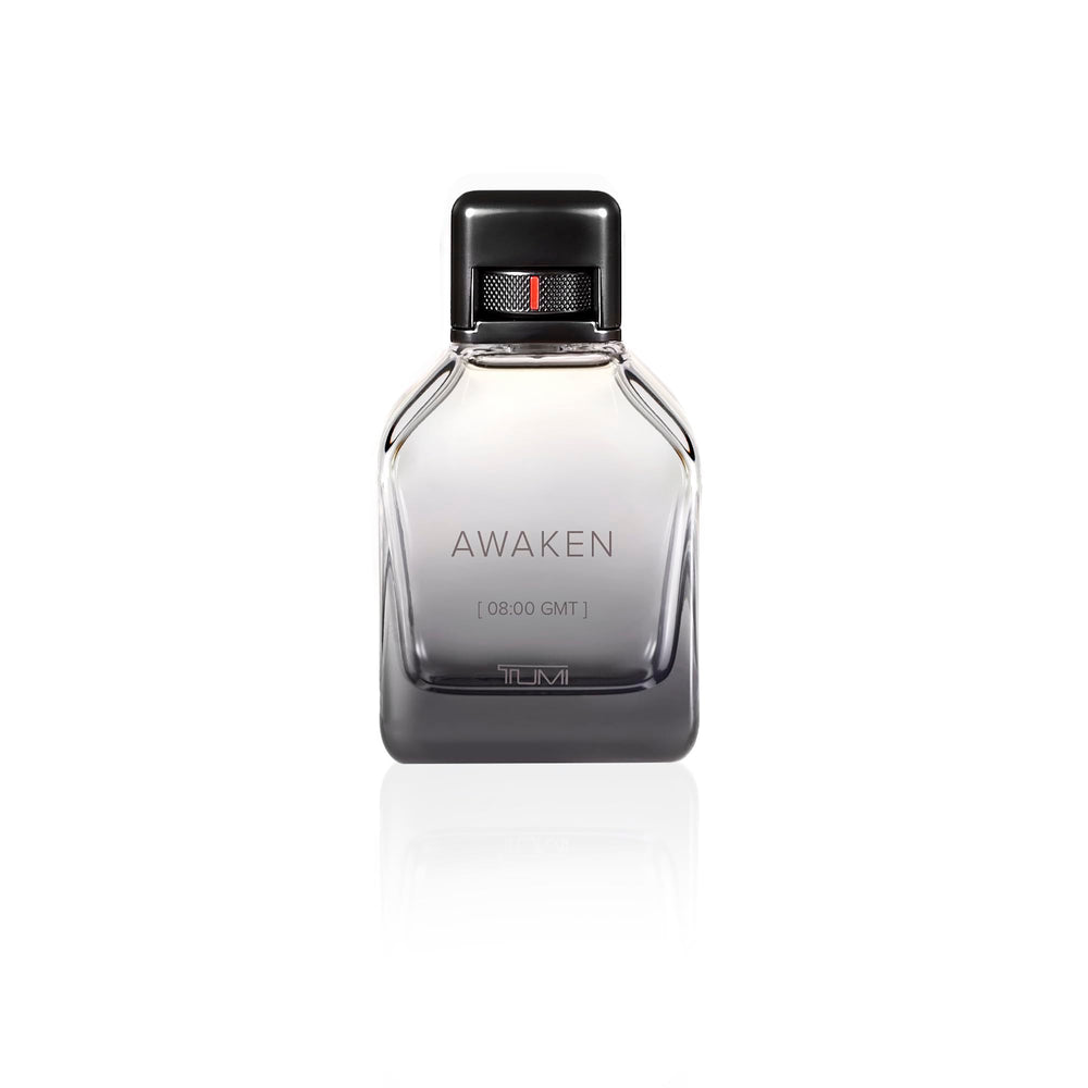 TUMI Awaken for Men applying to pulse points for long-lasting scent