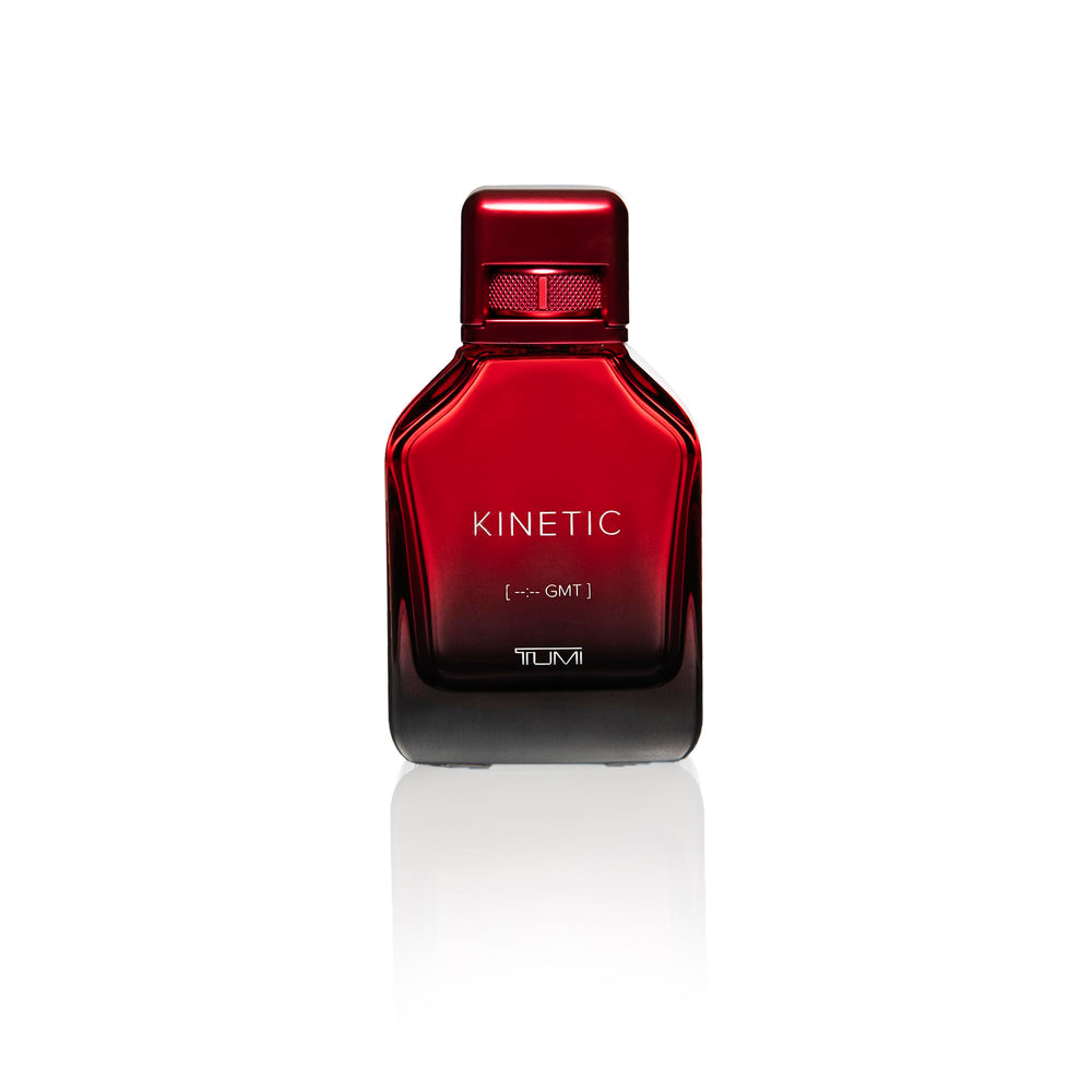 TUMI Kinetic for Men spray action captured mid-application for fresh, confident onset.