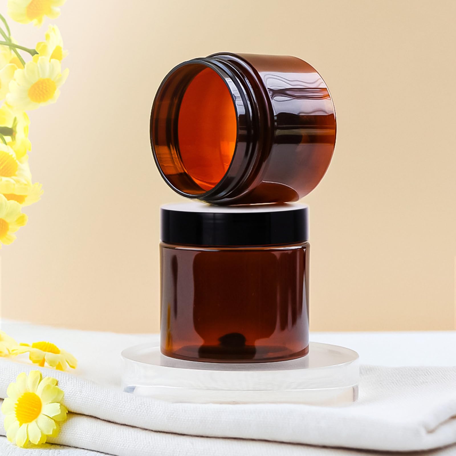 TUZAZO amber 2 oz jar close-up showing secure lid for leakage prevention.