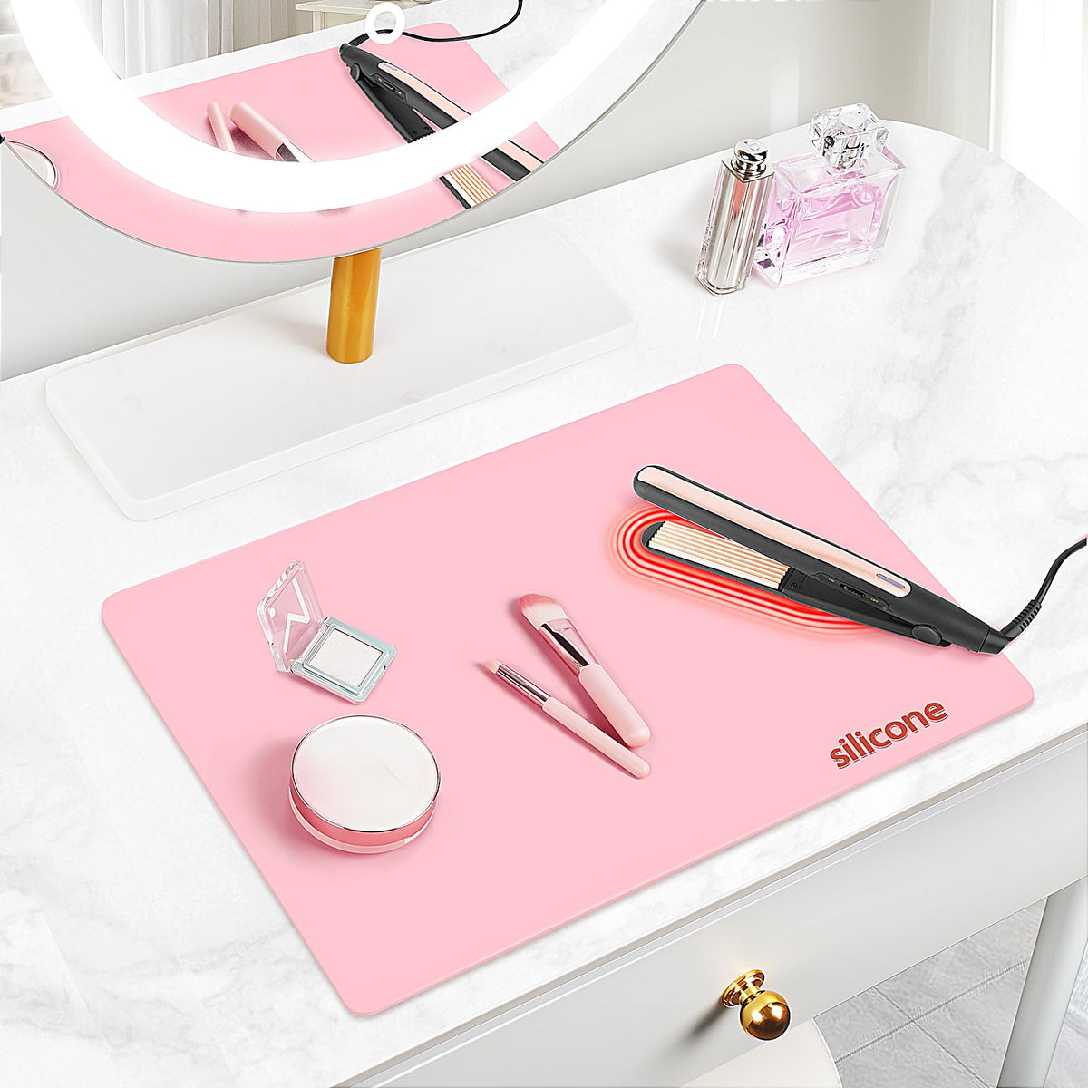 TWAKAP silicone makeup mat on pink vanity protects surfaces and simplifies prep