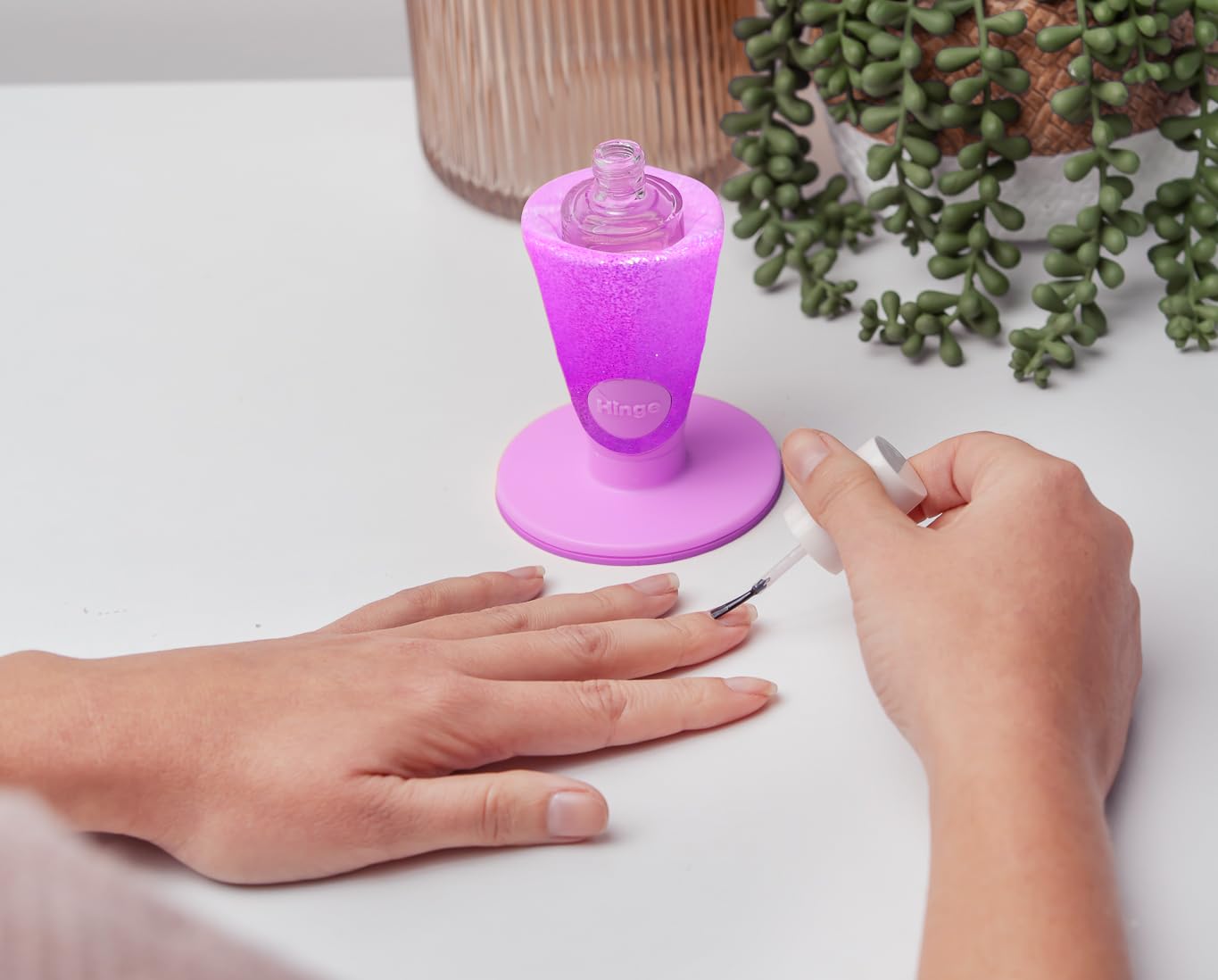 Tweexy Hinge anti-spill bottle holder front view keeps bottles secure during manicures.