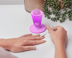 Tweexy Hinge anti-spill bottle holder front view keeps bottles secure during manicures.