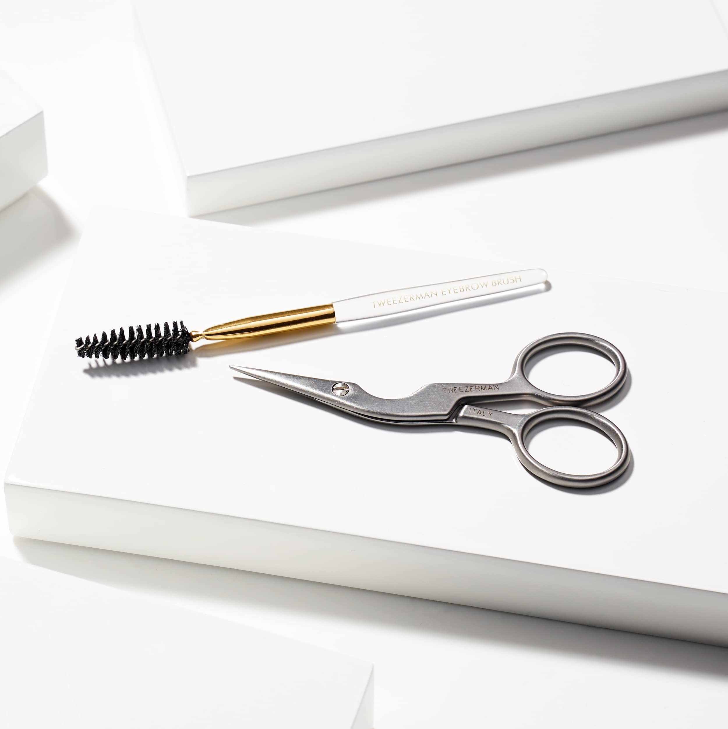tweezerman brow shaping steps using to trim hair one by one