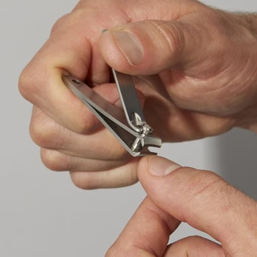 Tweezerman Essential Grooming Kit fingernail-clipper-curved-blade demonstrates precise nail trimming.