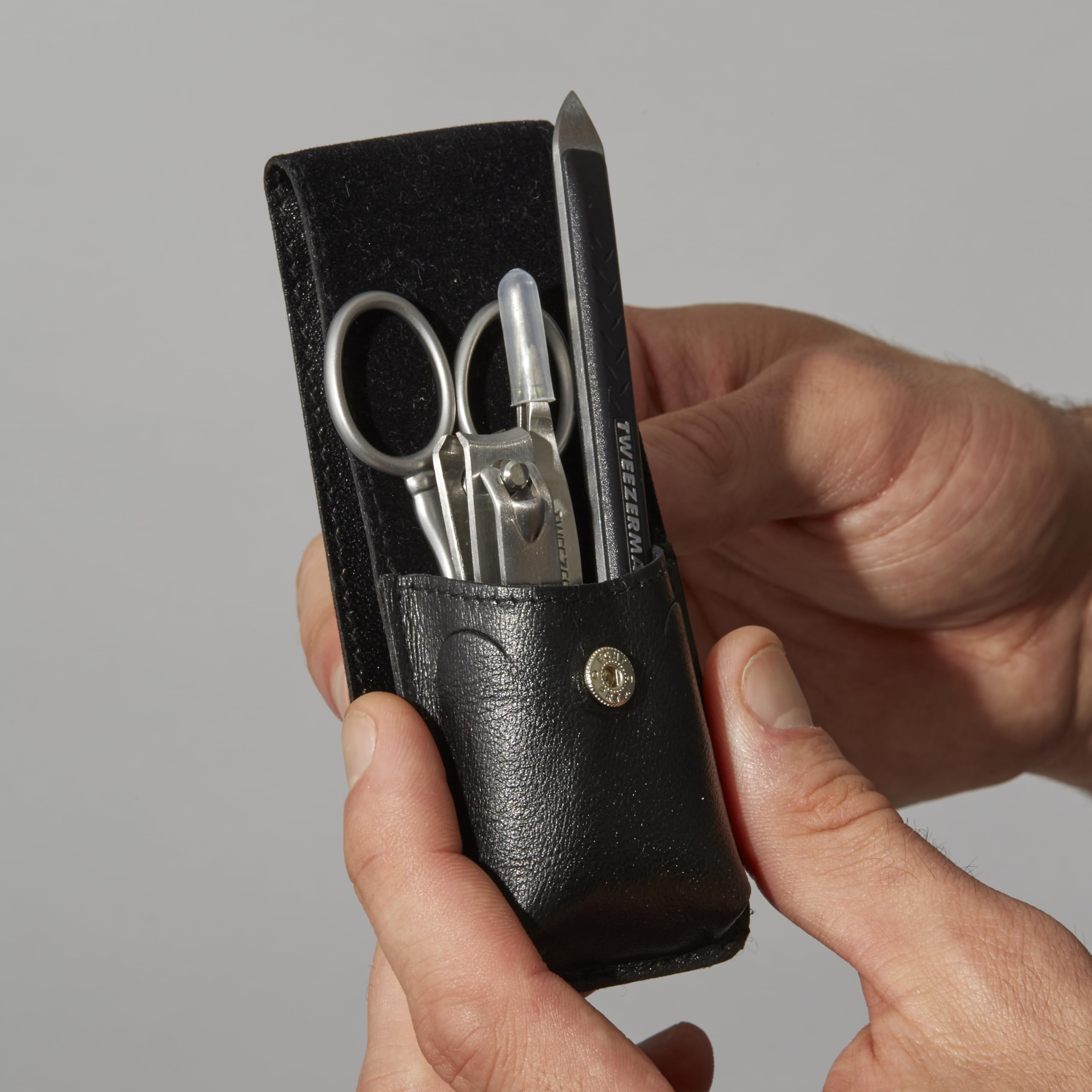 Tweezerman Essential Grooming Kit travel-case-open highlights organized travel grooming.