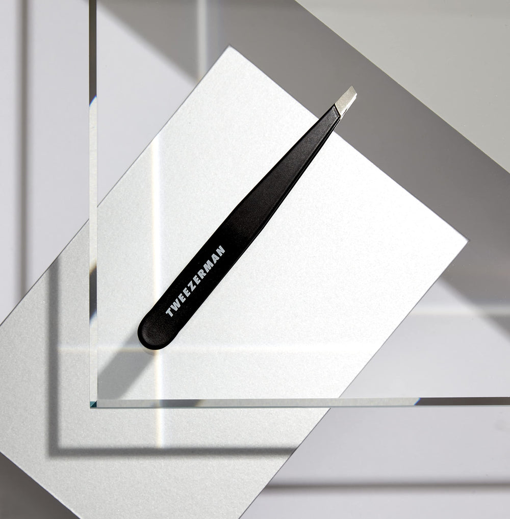 Tweezerman G.E.A.R. Slant Tweezer Midnight warm-cloth skin prep for easier tweezing