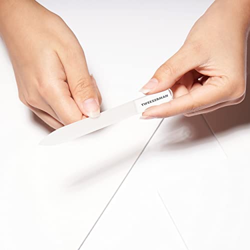 Tweezerman Glass Manicure Set glass nail file in action for smooth edges.