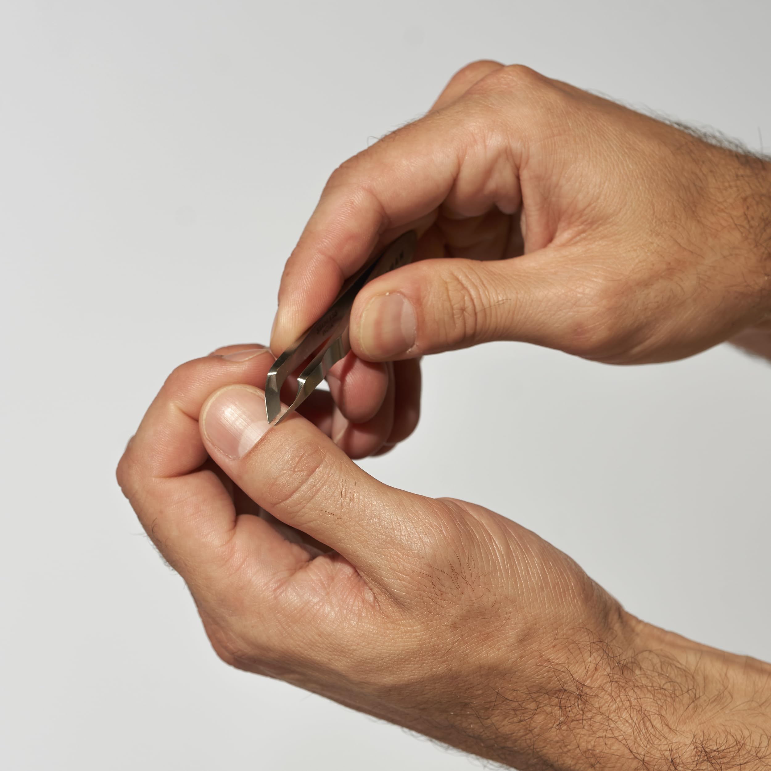 Tweezerman Mini Squeeze Cutical Nipper silver angled blades for clean, accurate trims.
