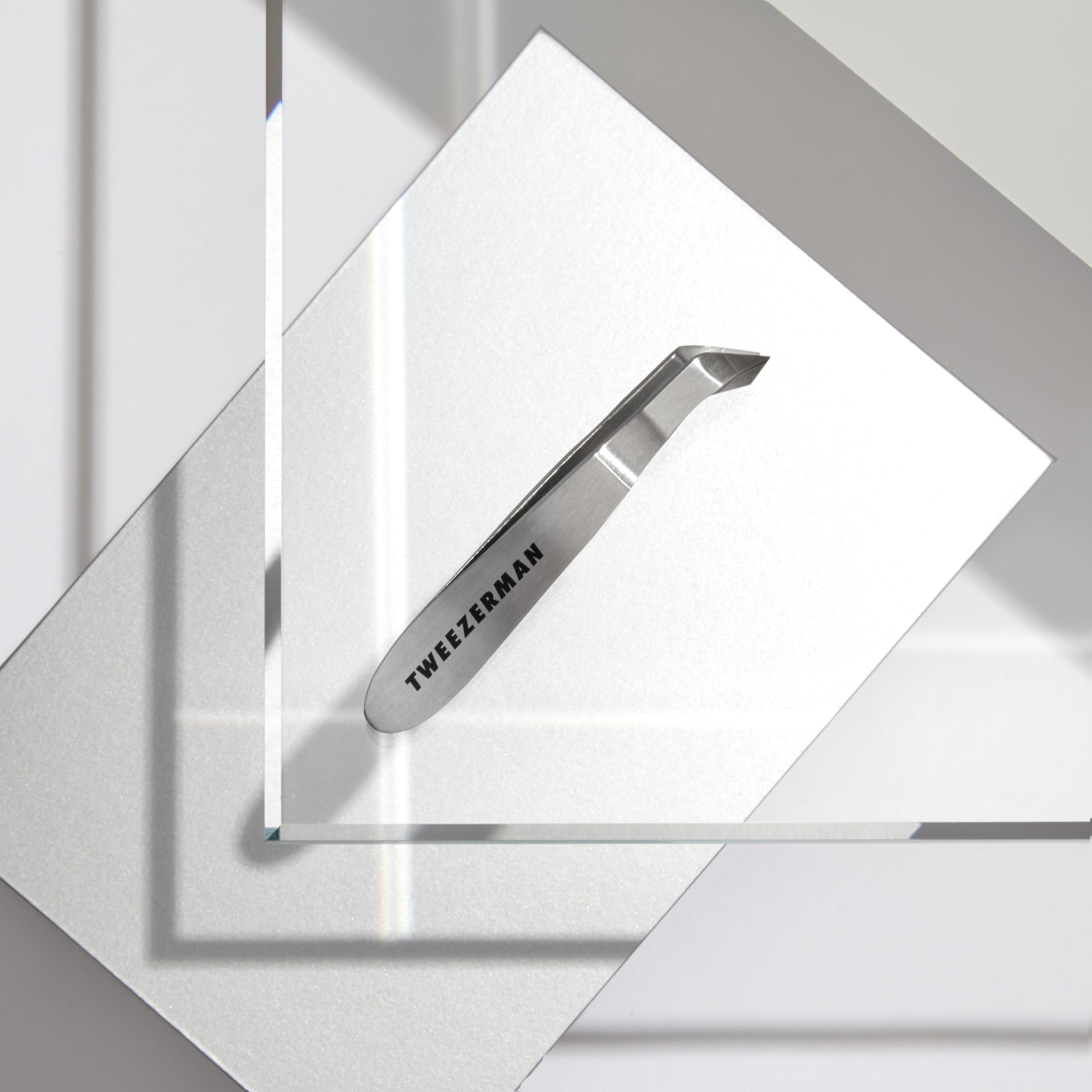 Tweezerman Mini Squeeze Cutical Nipper silver packaging-ready display.