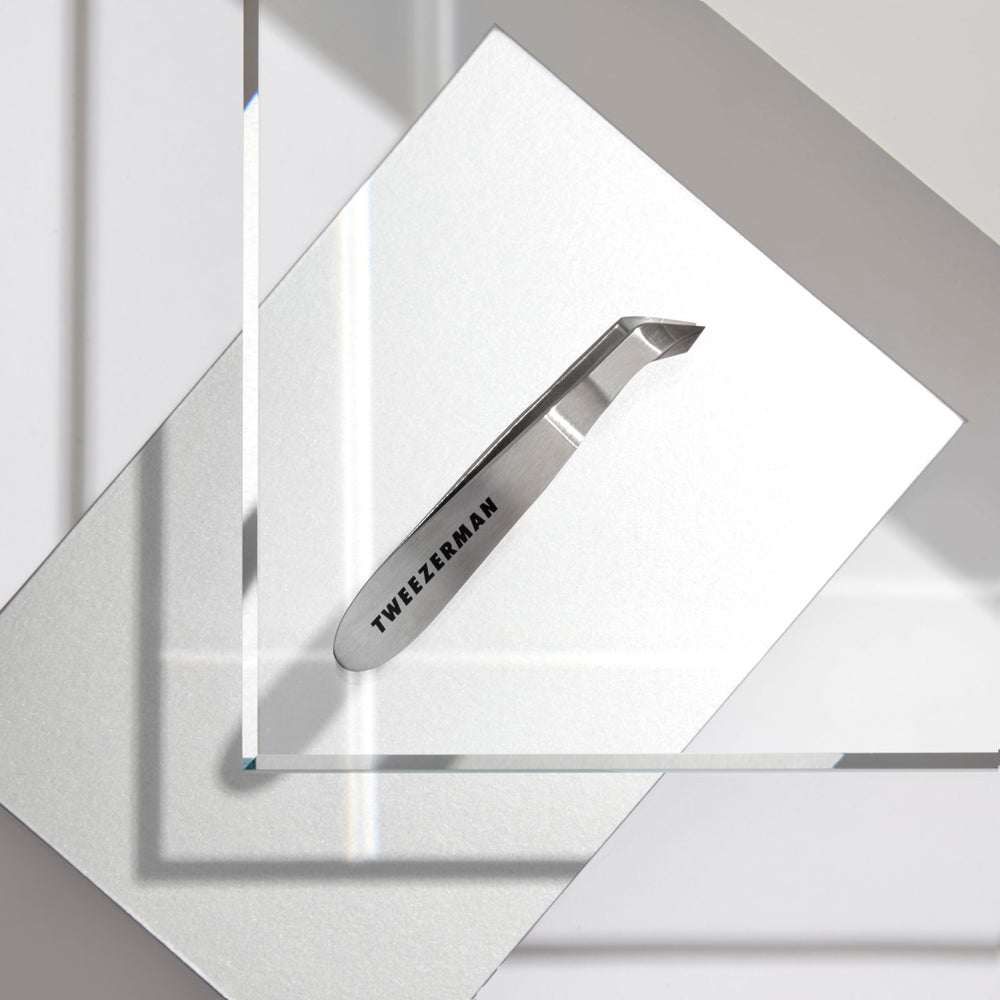 Tweezerman Mini Squeeze Cutical Nipper silver packaging-ready display.