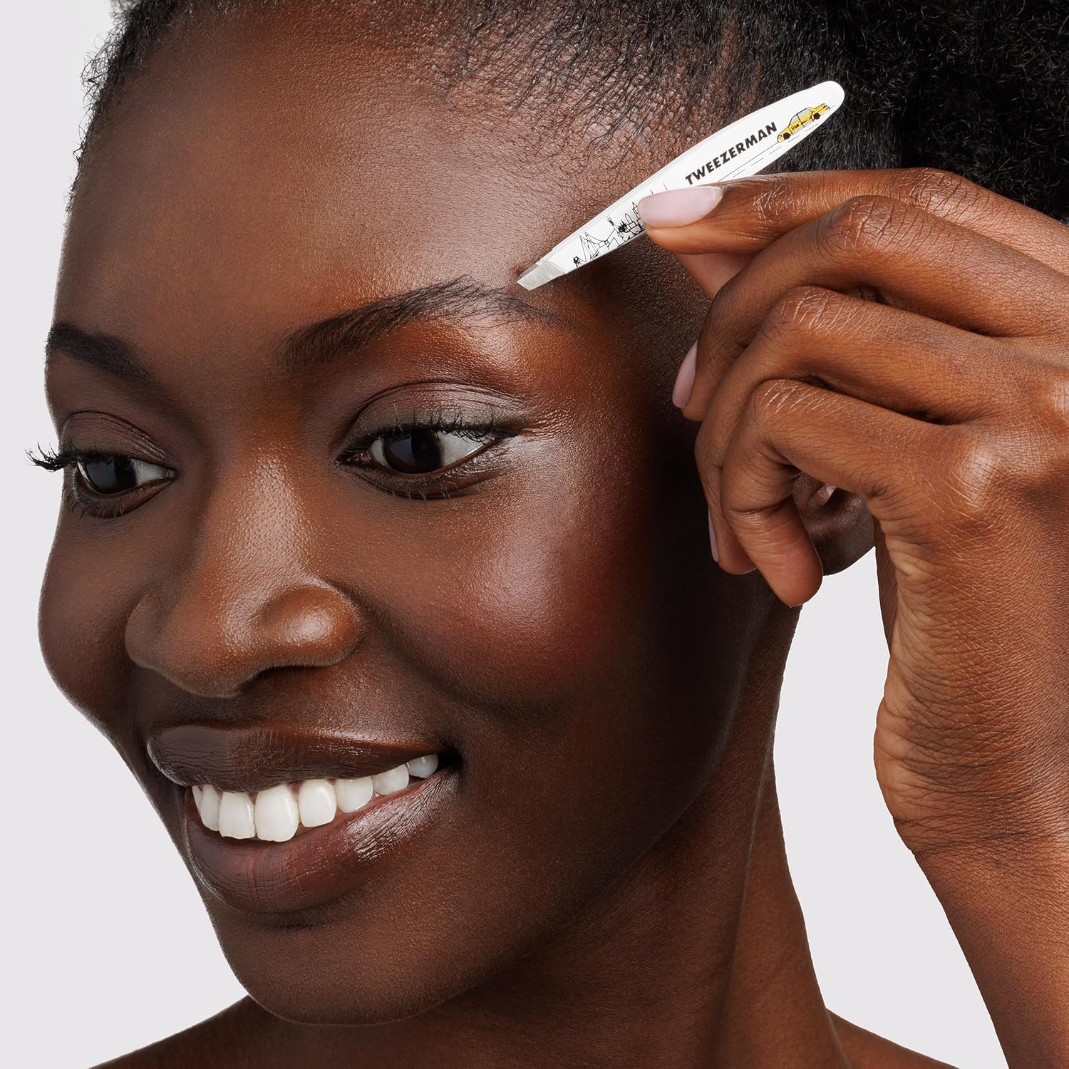 Tweezerman NYC Mini Slant Tweezer travel compact ready for on-the-go grooming touch-ups.