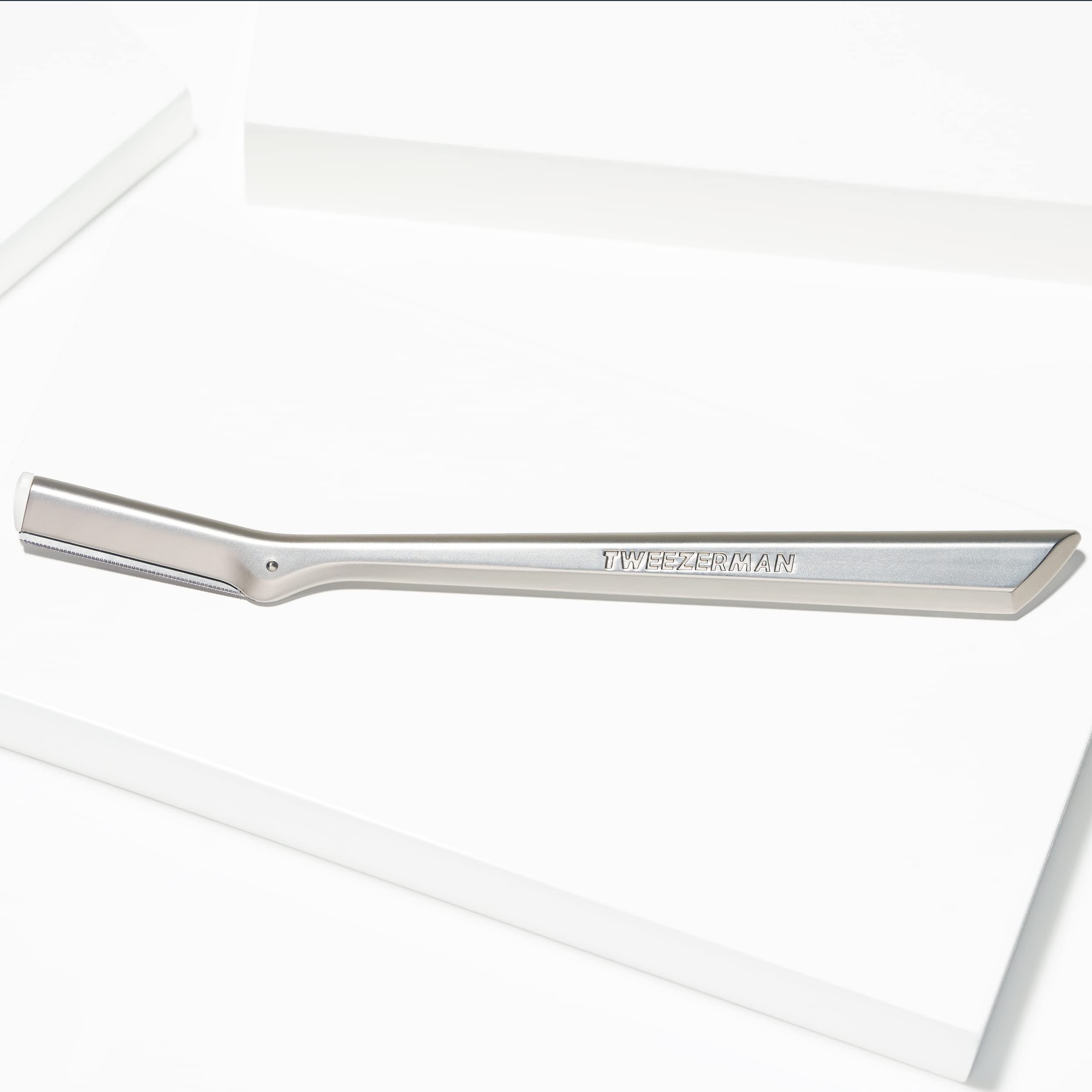 Tweezerman peach fuzz removal shows smooth skin prep.