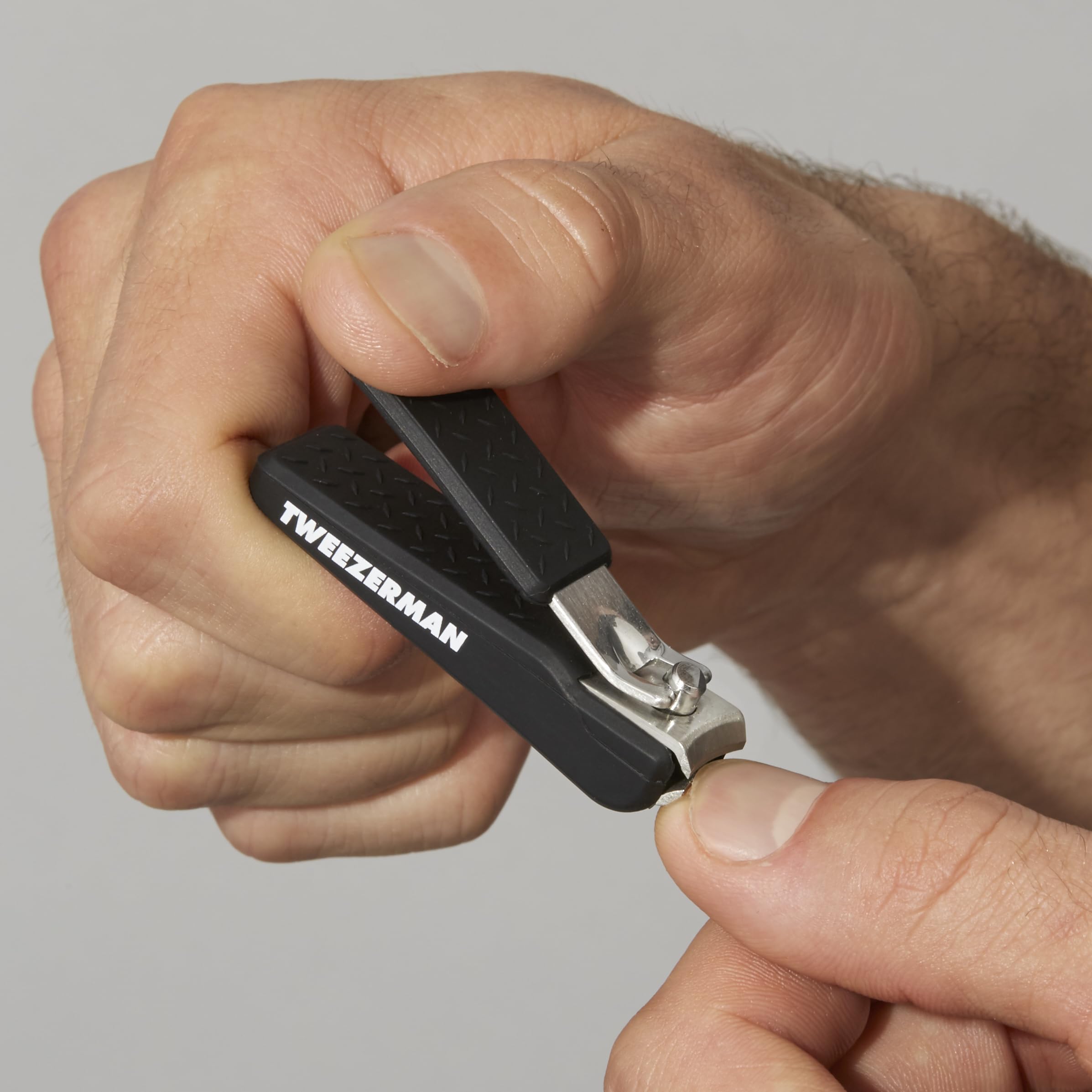 Tweezerman Precision Grip Fingernail Clipper in black demonstrates easy cleaning and storage readiness.
