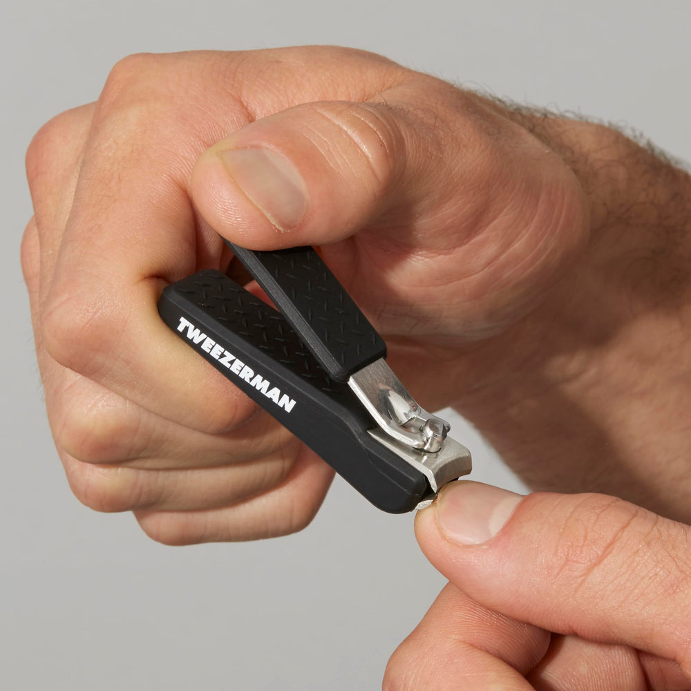 Tweezerman Precision Grip Fingernail Clipper in black demonstrates easy cleaning and storage readiness.