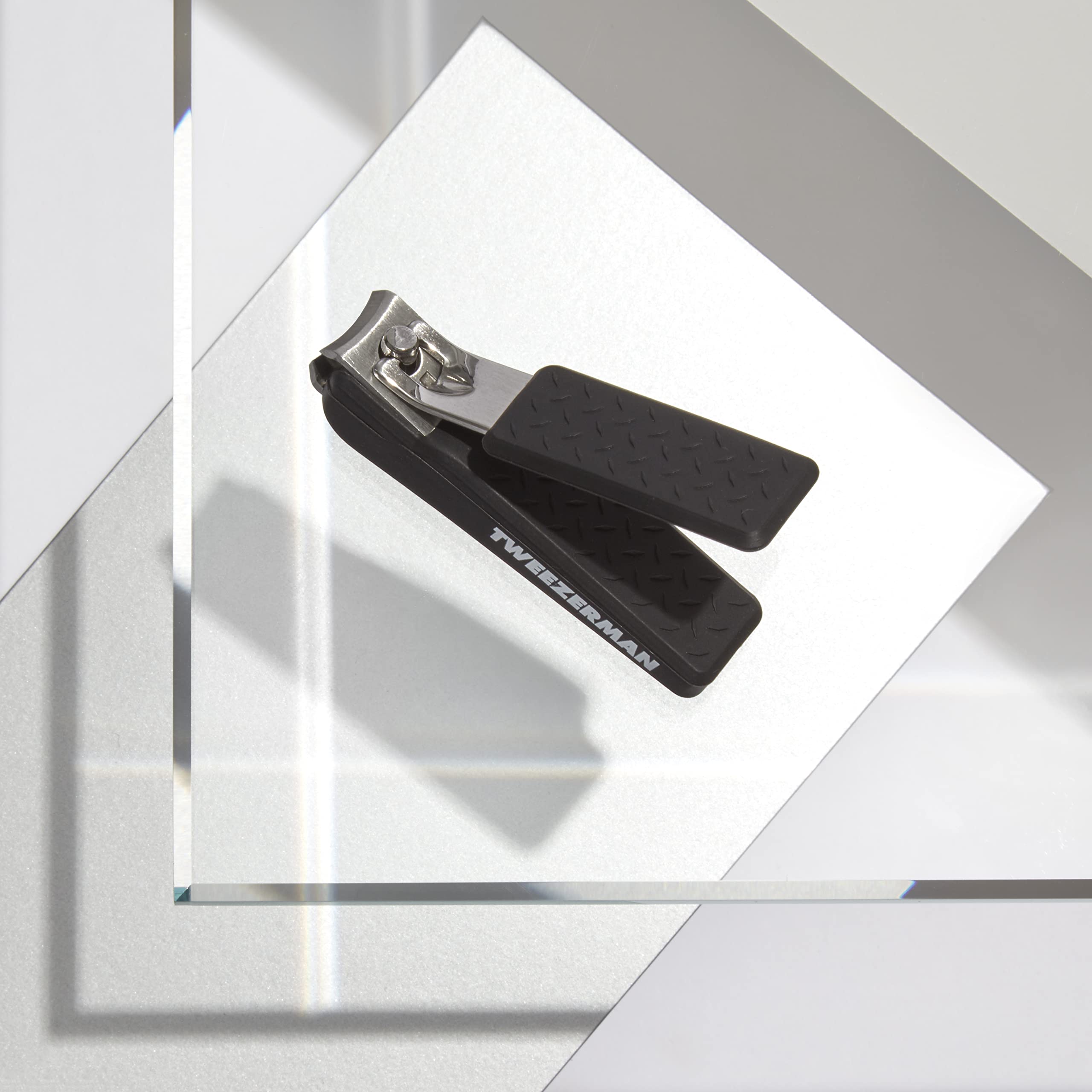 Tweezerman Precision Grip Fingernail Clipper in black with textured handle for comfort and control.