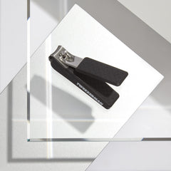 Tweezerman Precision Grip Fingernail Clipper in black with textured handle for comfort and control.