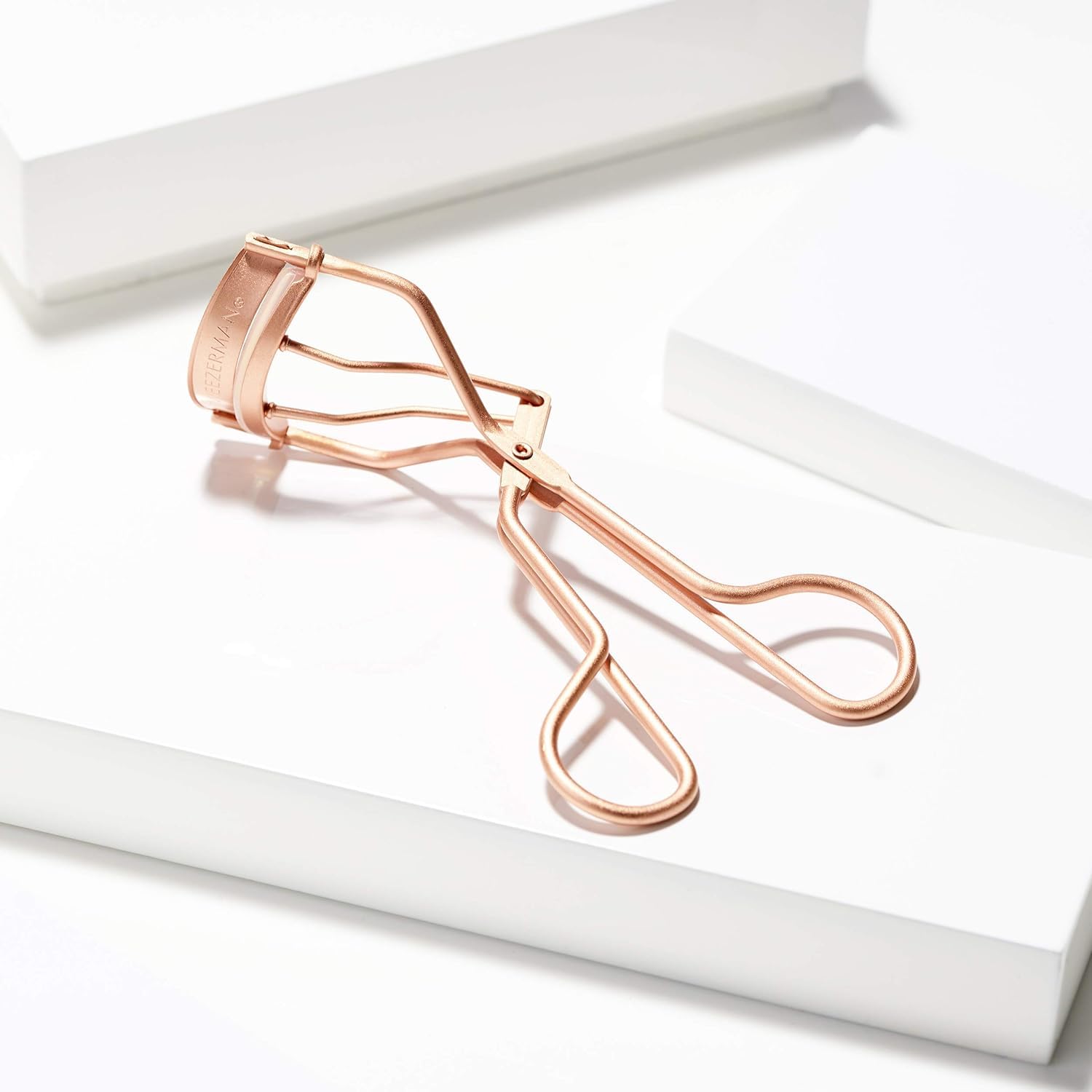 Tweezerman Rose Gold Eyelash Curler portable size fits makeup bags.