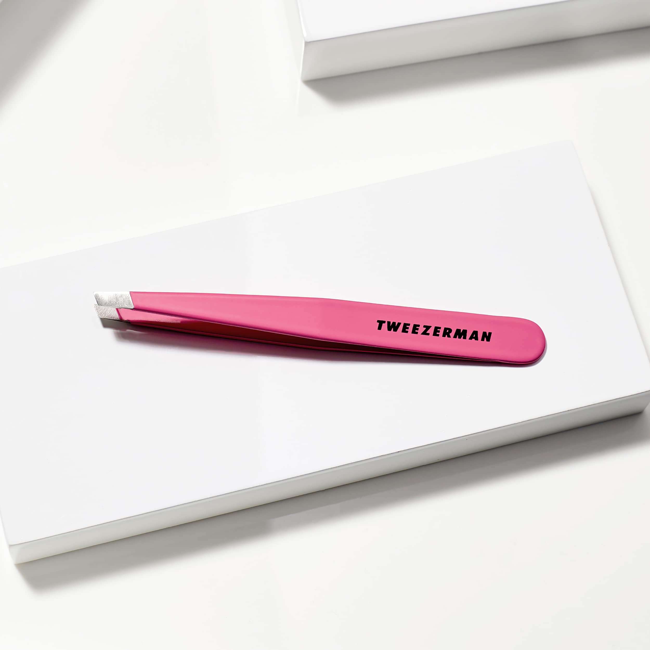 Tweezerman in-use brow shaping image highlights precise removal at the brow bone