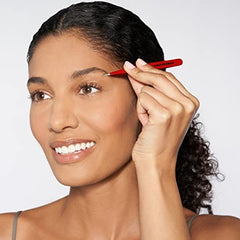 Tweezerman stainless steel point tweezer removing ingrown hair with controlled grip.