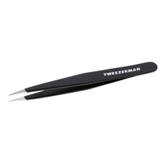 Tweezerman stainless steel point tweezer close-up with precision tips for fine brow hair removal.