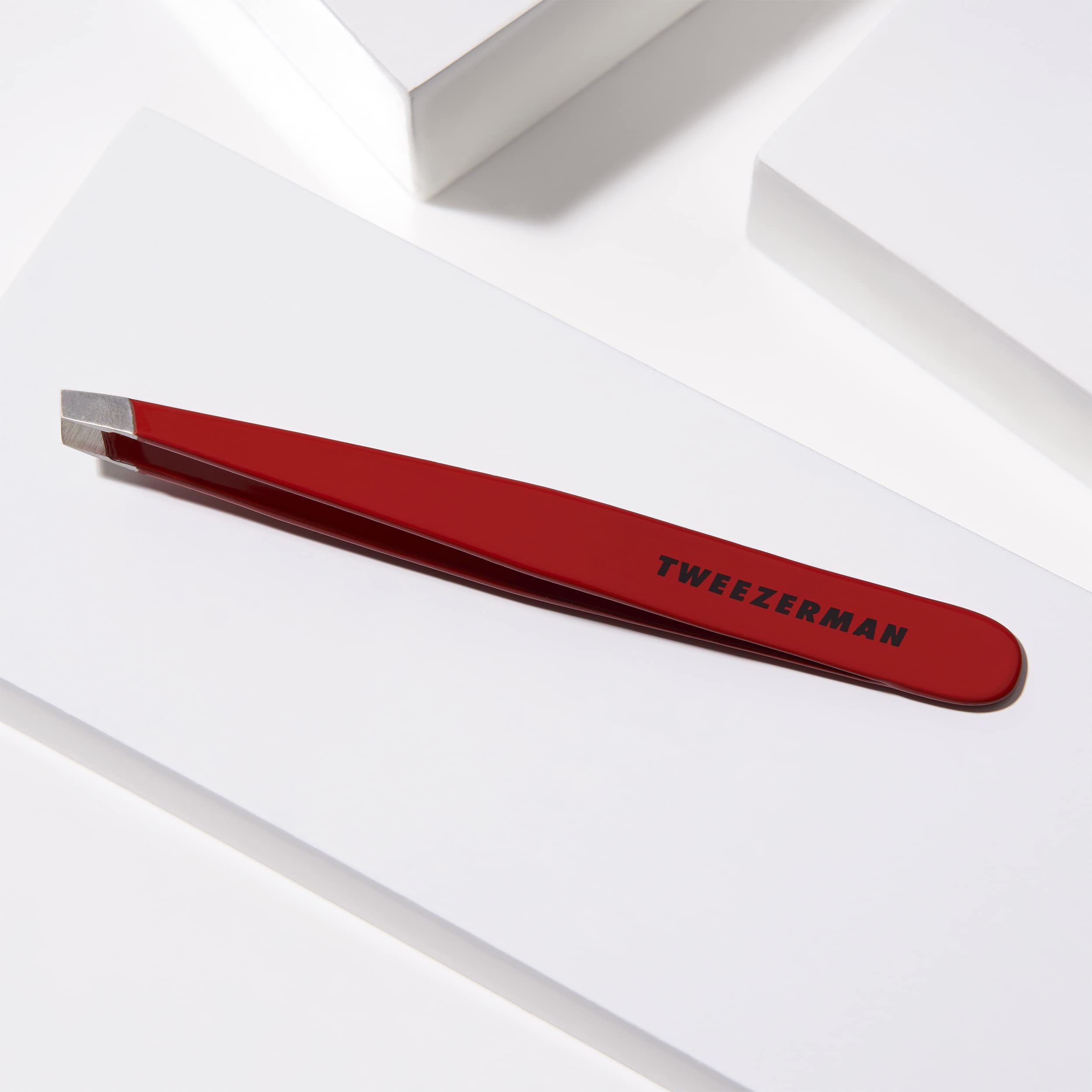 Tweezerman stainless steel slant tweezer brow shaping in use shows accuracy.
