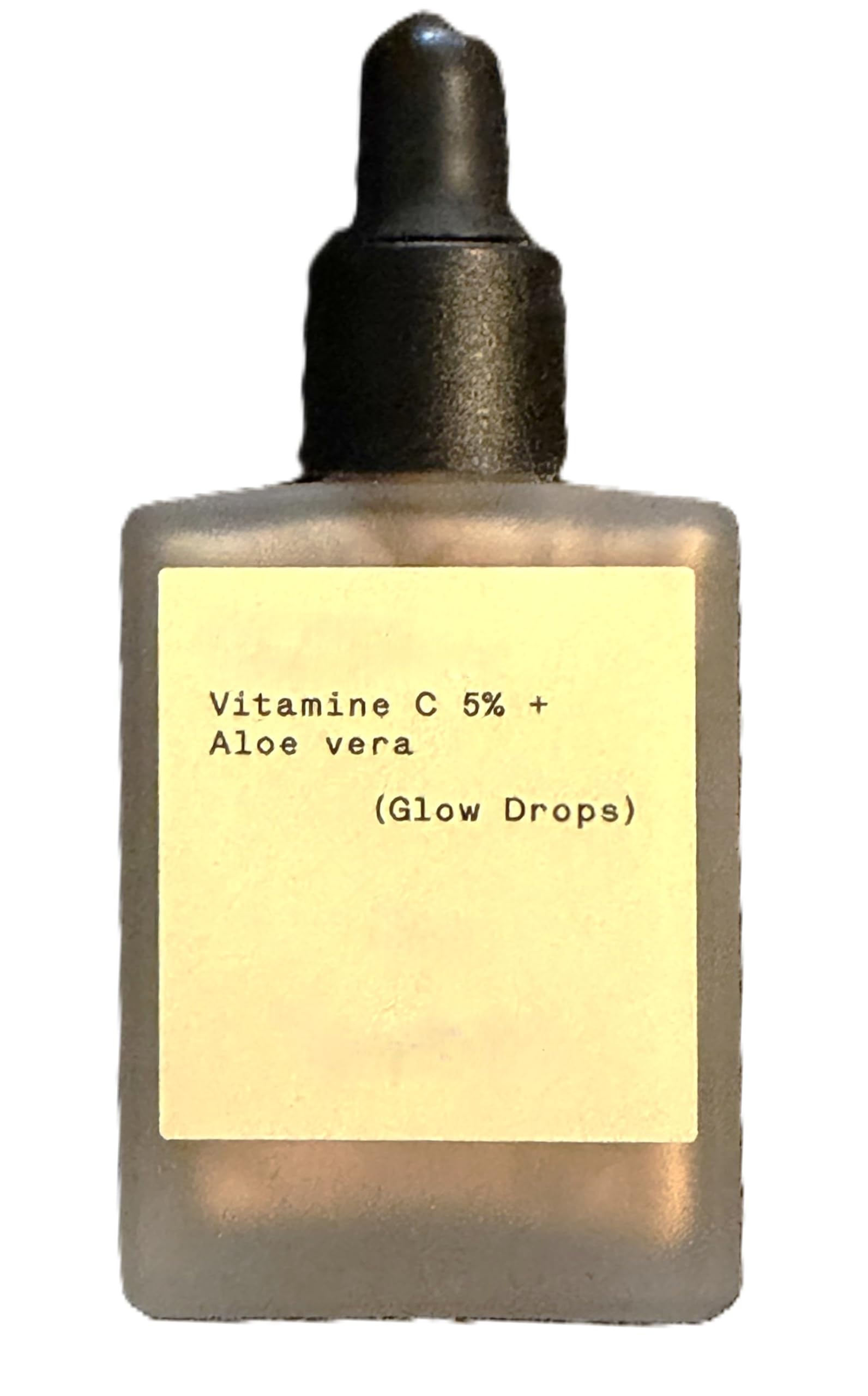 Typology Glow Drops bottle close-up showing vegan vitamin C serum for radiant skin.