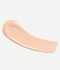 Typology tinted serum being applied with brush for even skin tone.