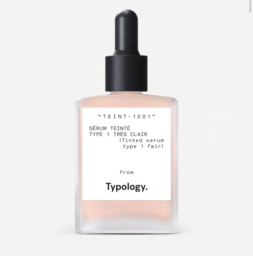 Typology tinted serum packaging highlights a vegan, silicone-free formula for a natural finish.