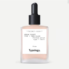 Typology tinted serum packaging highlights a vegan, silicone-free formula for a natural finish.